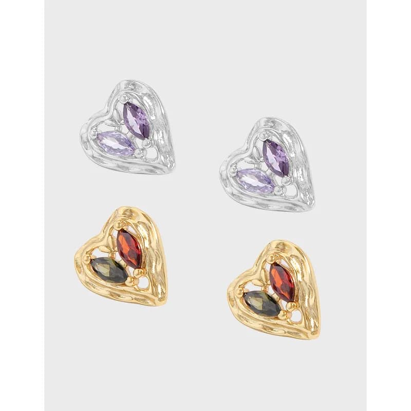 Openwork heart earrings in two colorways, featuring marquise-cut stones in silver and gold finishes.
