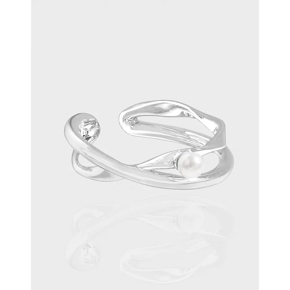 Polished sterling silver open twist ring with a pearl accent on one end.
