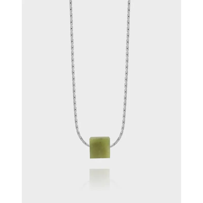 Sterling silver chain with a pale green square jade pendant centered on a light background.