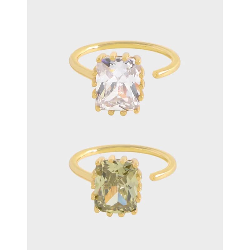 Polished sterling silver ring with a square cushion-cut gemstone held by a dotted bezel