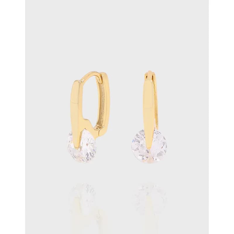 Polished gold-tone drop earrings with a clear crystal pendant on hinged hoops