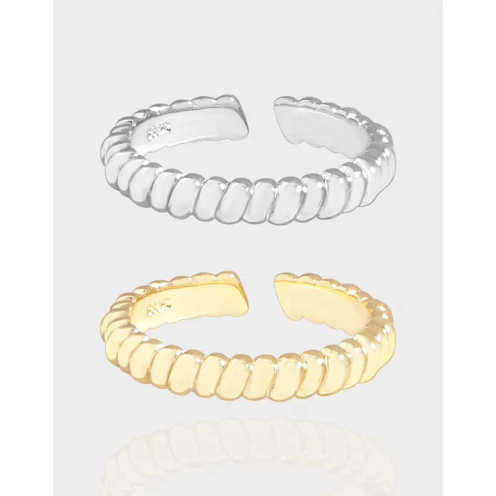Polished ribbed bead ring in silver (and gold tone) shown on a light background with an open, adjustable band.
