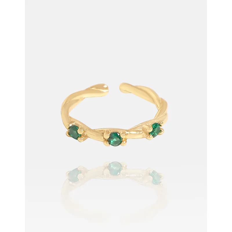 Polished sterling silver ring with three green stones set along a curved band on a white background.