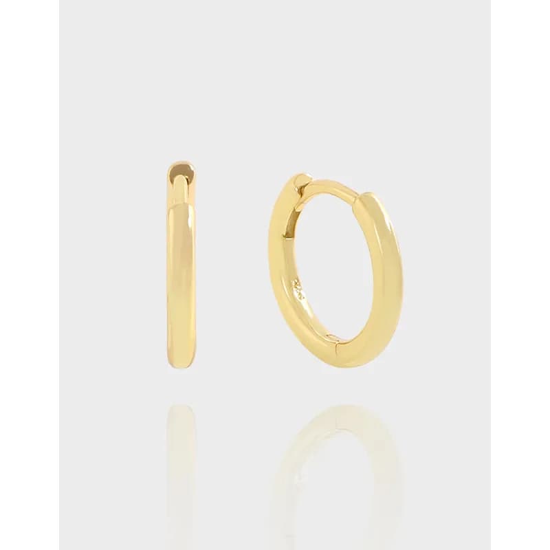 Polished sterling silver hoop earrings shown from the side and front with a small hinged closure