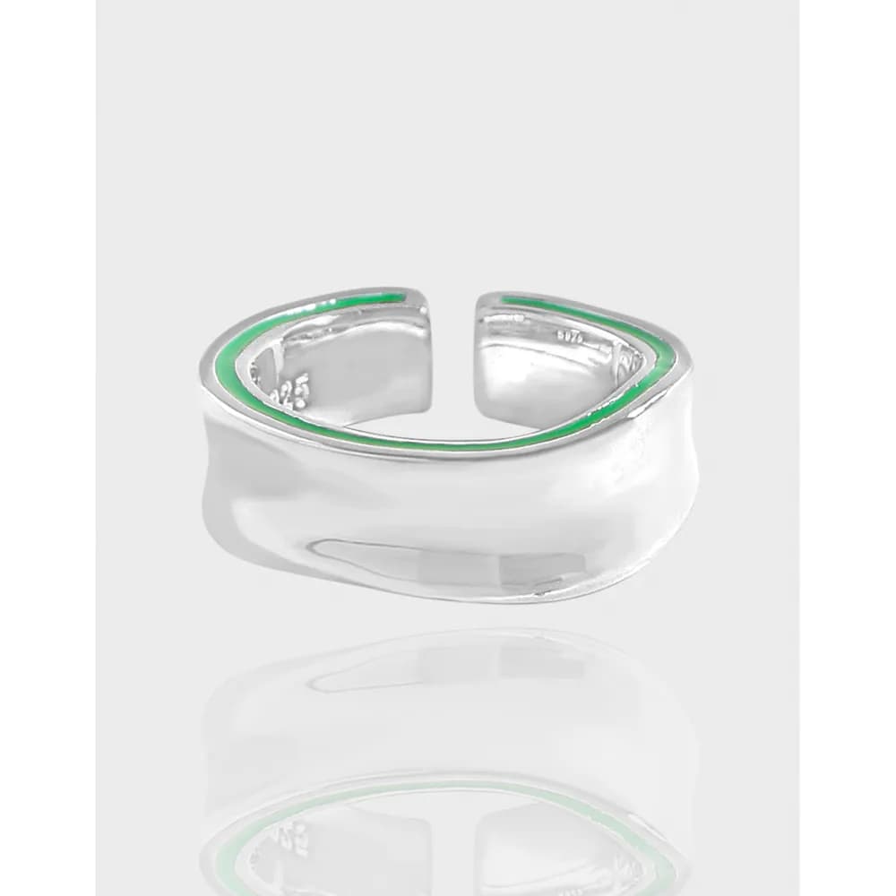 Polished sterling silver open cuff ring with a thin green enamel trim along the top edge.