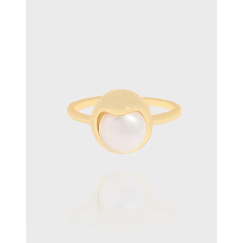 Polished sterling silver ring with a round pearl set in a curved bezel
