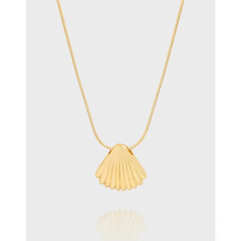 Polished shell pendant on a delicate chain necklace