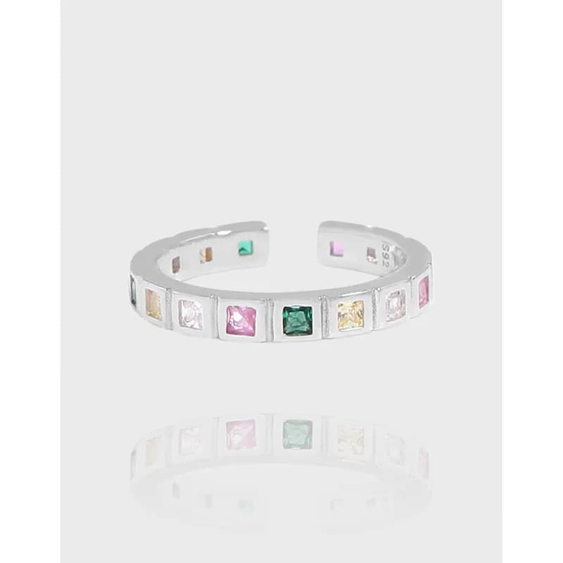 Polished sterling silver open-ring with square multicolor stones set along the band.