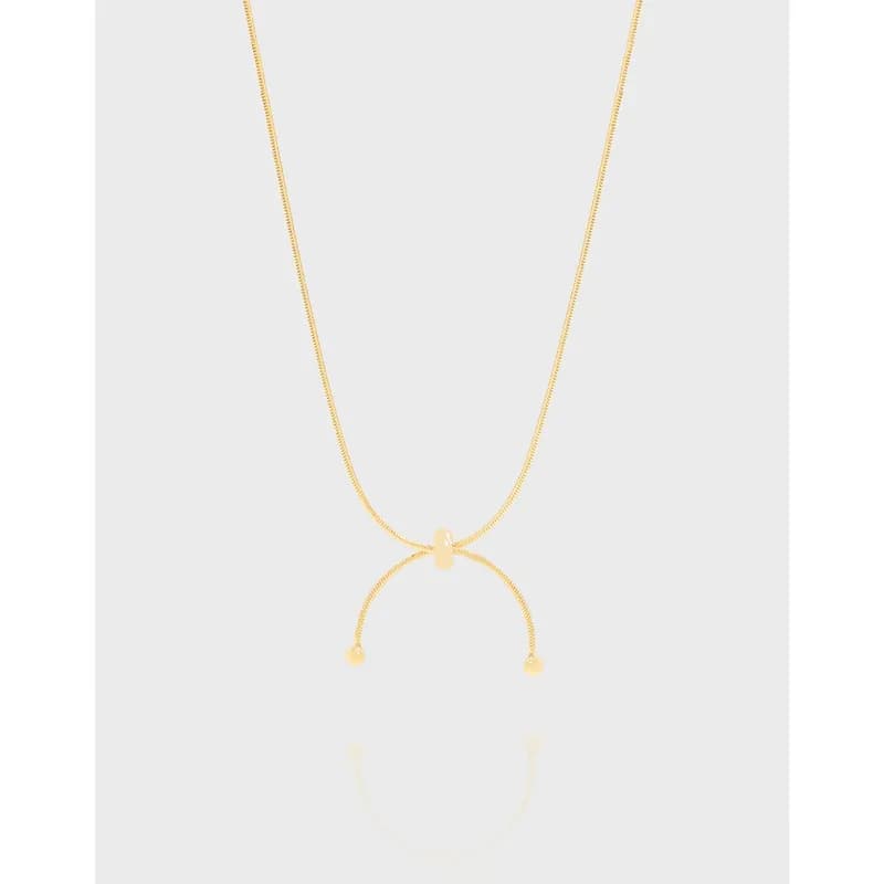 Polished sterling silver necklace with a curved open arc pendant and bead-ended tips on a delicate chain.