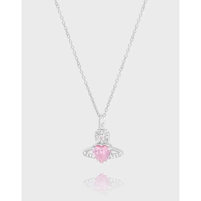 Delicate sterling silver necklace with a pink heart pendant surrounded by a pavé halo and orbiting ring