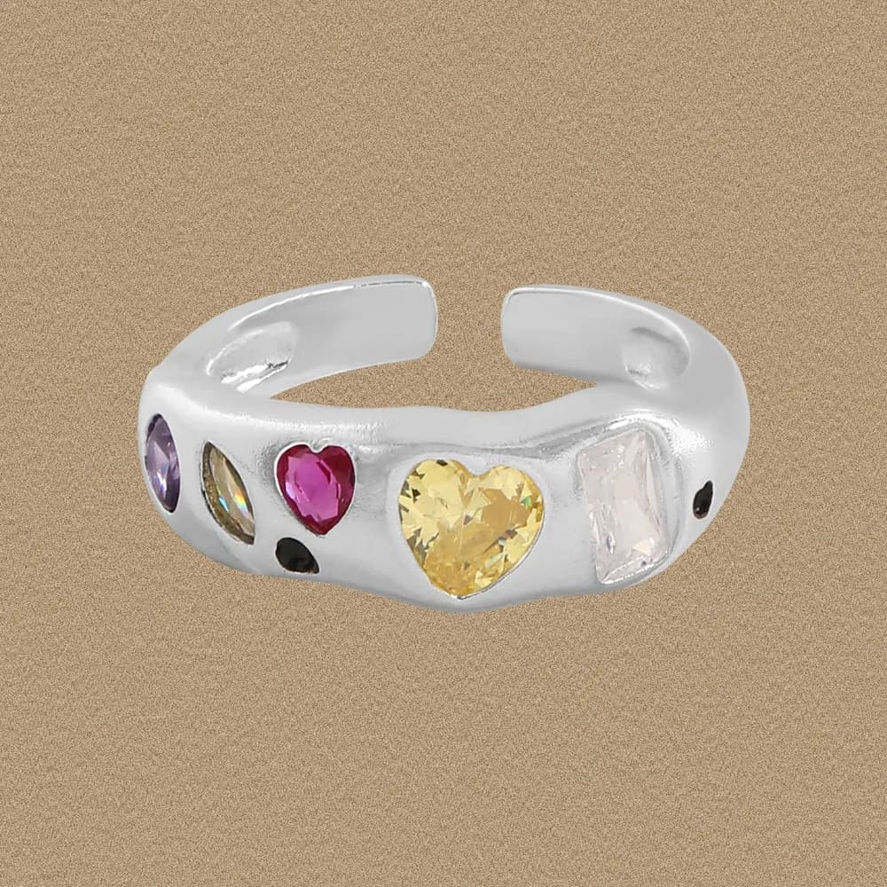 Polished silver ring with a row of colorful gemstone accents set along the band.