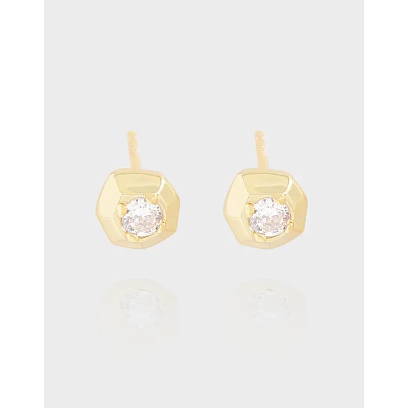 Pair of polished sterling silver octagon stud earrings with central clear stones.
