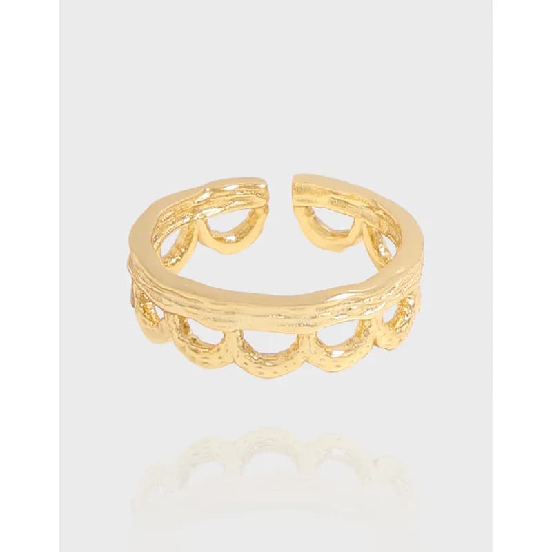 Polished scalloped linked ring with open back and warm gold-tone finish on a white background.