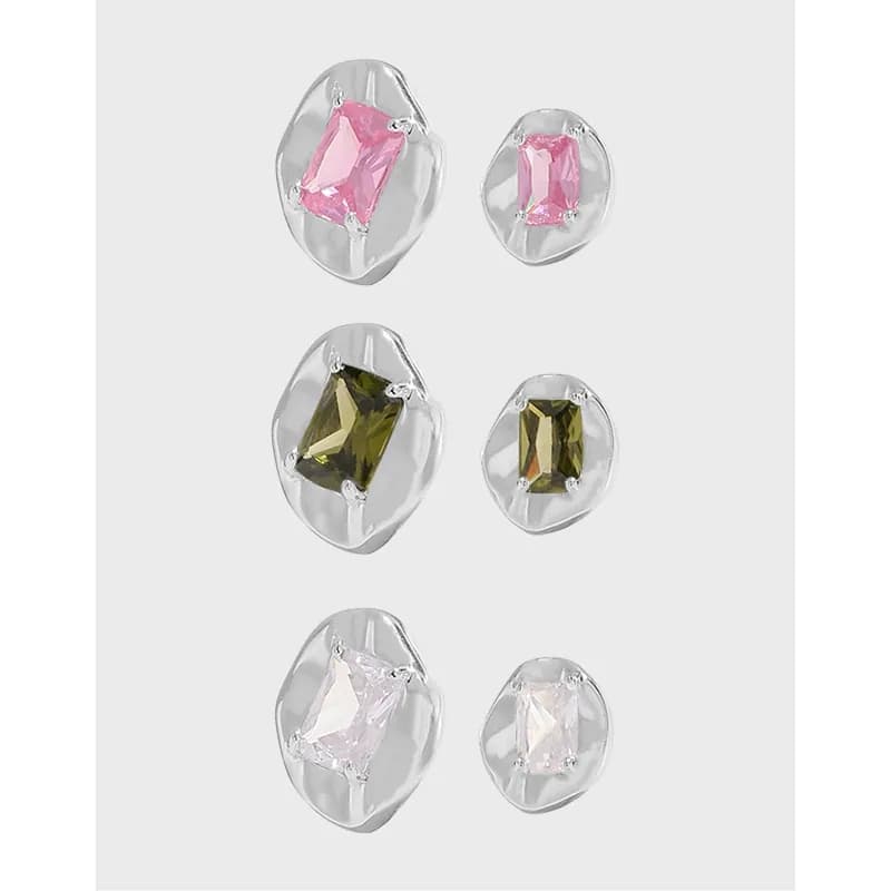 Polished sterling silver rectangular gem stud earrings in an irregular disc setting.