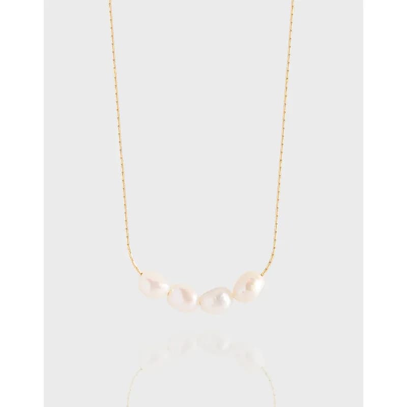 Polished sterling silver necklace with a small curve of four white freshwater pearls.