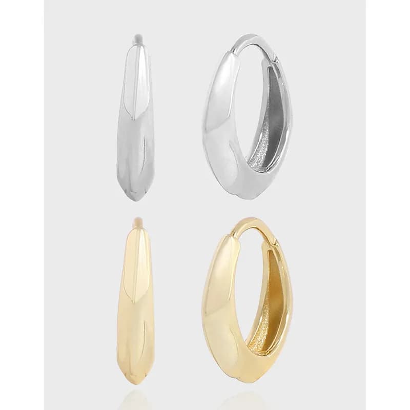 Polished teardrop hoop earrings in silver and gold finishes with a smooth, reflective surface.
