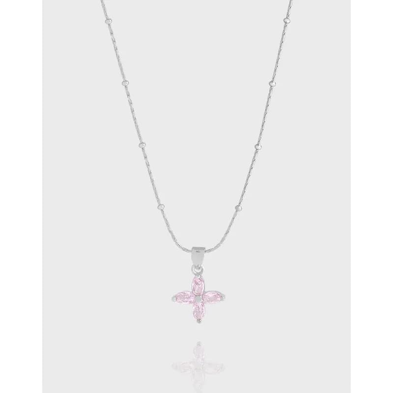 Delicate sterling silver beaded-chain necklace with a pink stone cross pendant.
