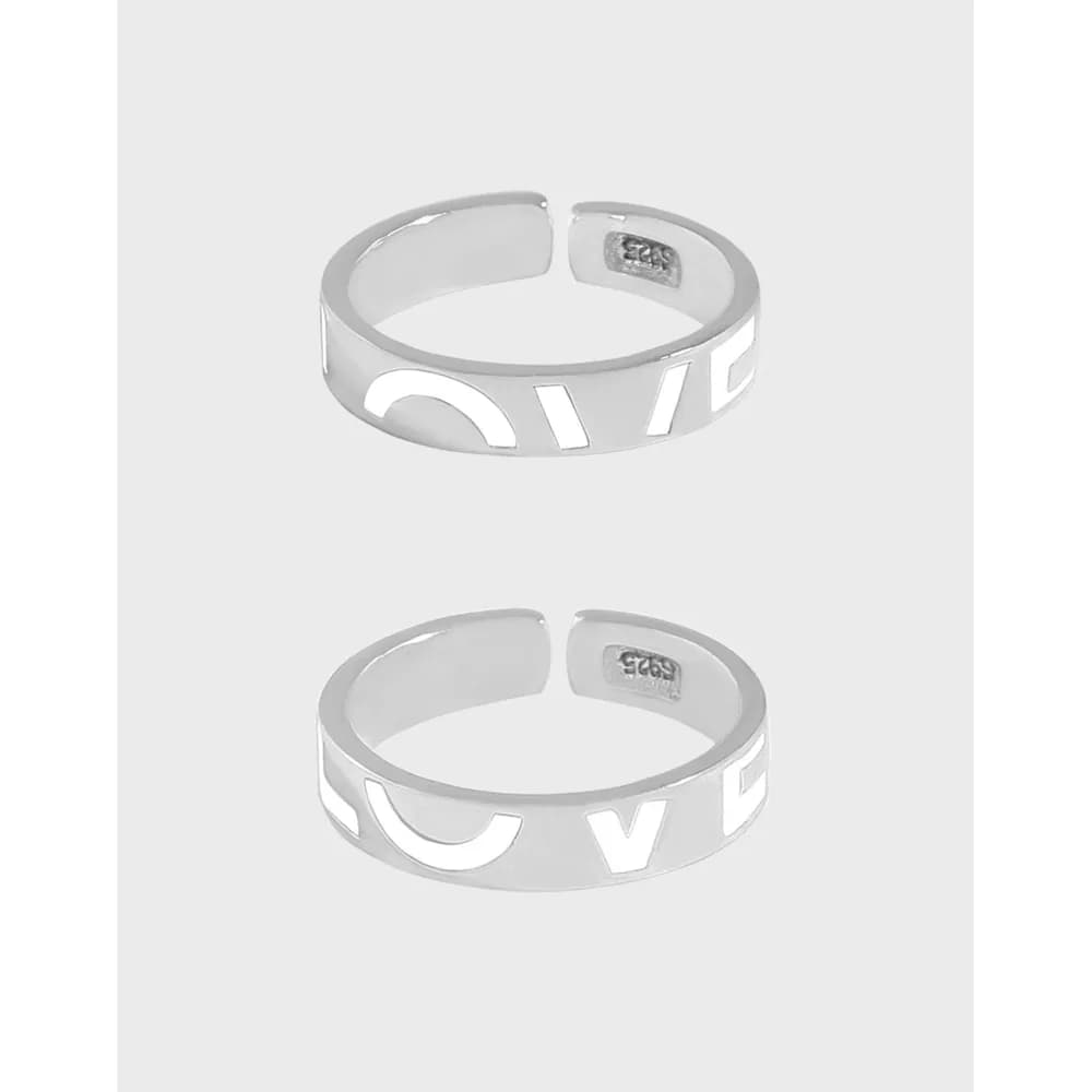 Polished sterling silver ring with cut-out letters forming the word LOVE around the band