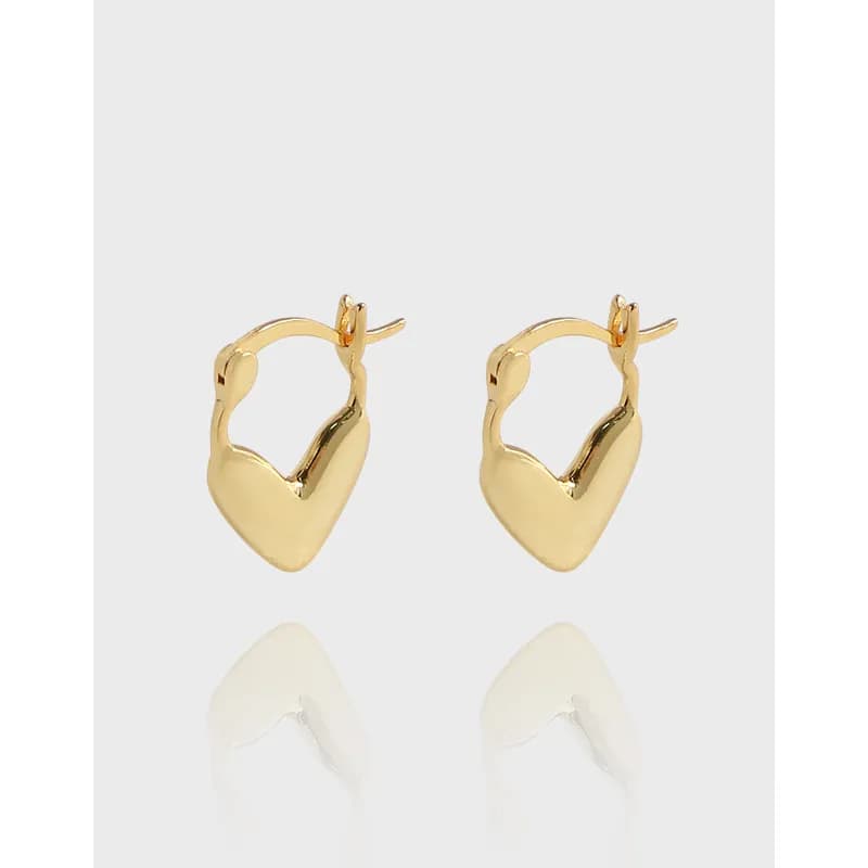 Polished sterling silver heart hoop earrings with hinged clasps shown on a light background.
