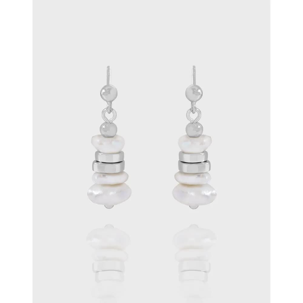 Sterling silver pearl stack drop earrings with linked pearls and silver discs.