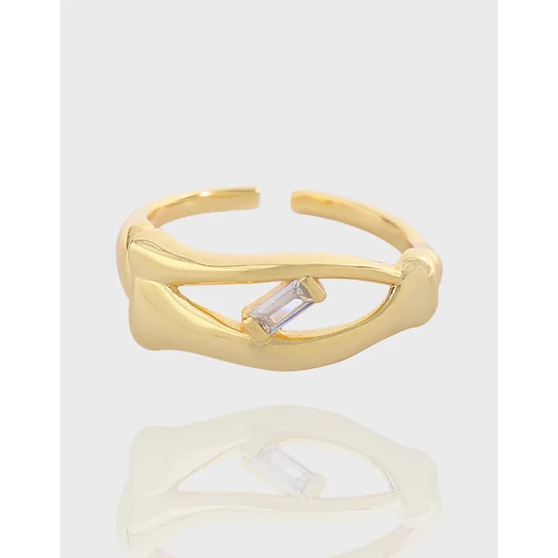 Polished open-wave sterling silver ring with a small rectangular gemstone set between the curved ends.