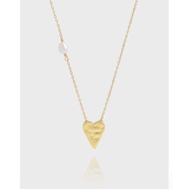 Delicate heart pendant necklace with a pearl bead on a fine chain