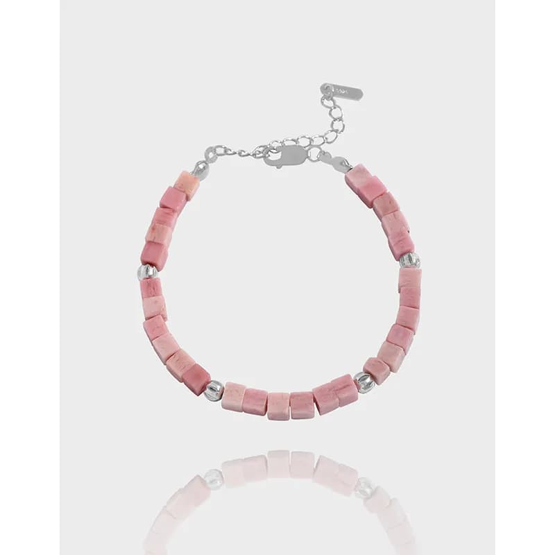 Polished sterling silver bracelet with pink cube beads on an adjustable chain