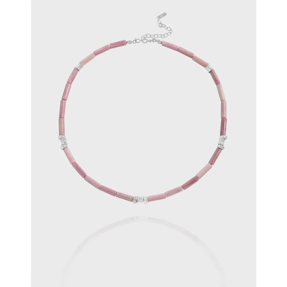 Sterling silver necklace with pink rectangular tube beads and silver spacers.