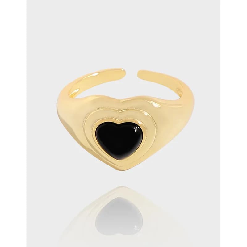 Polished silver open-ring with heart-shaped black centerpiece
