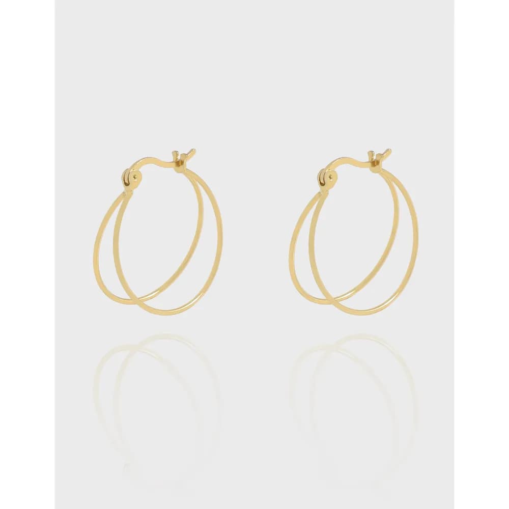 Pair of polished sterling silver double hoop earrings displayed against a light background.