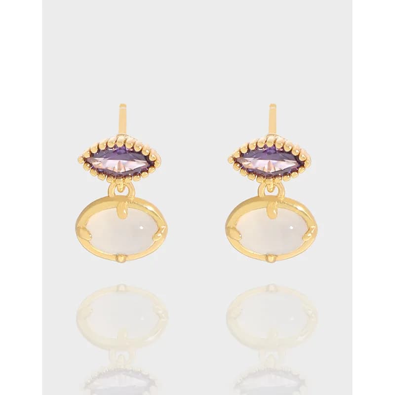 Polished sterling silver earrings with a beaded purple halo and clear oval drop