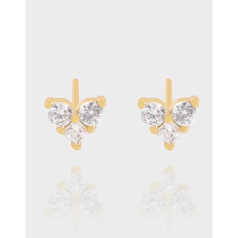 Pair of heart-shaped crystal cluster earrings in a polished metal setting