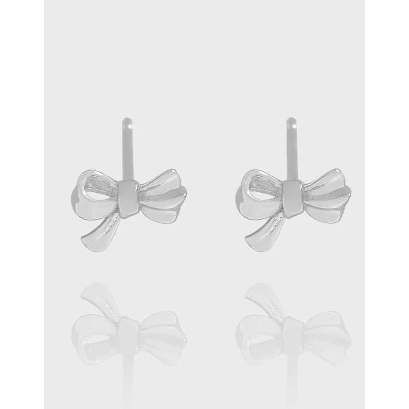 Polished sterling silver bow-shaped stud earrings shown from the front