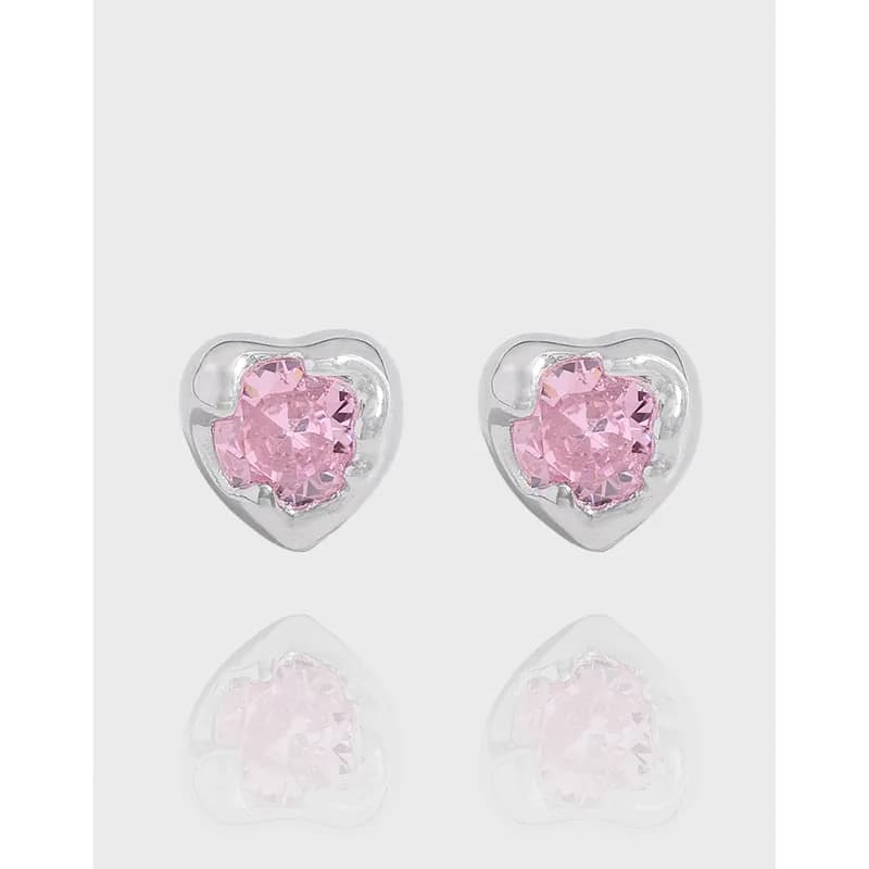 Pair of polished sterling silver heart-shaped earrings with pink central stones.
