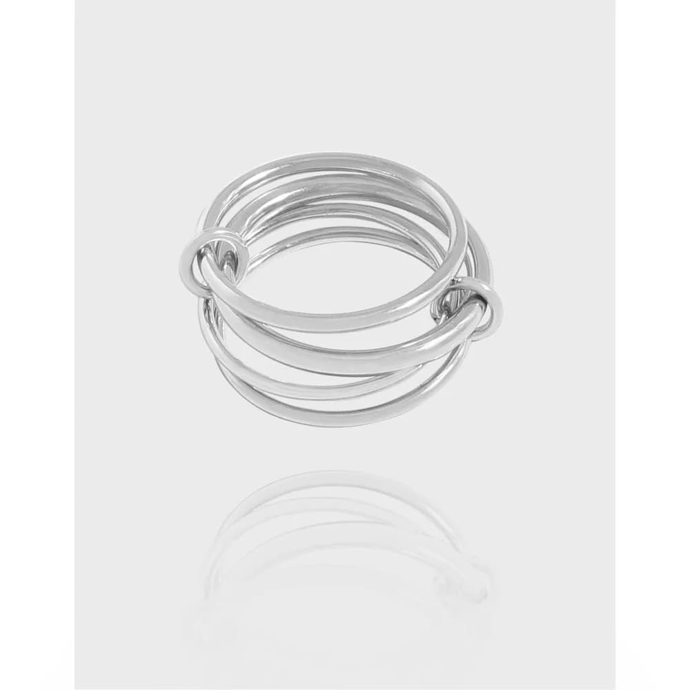 Polished sterling silver interlocking loop ring with several intertwined bands on a white background.