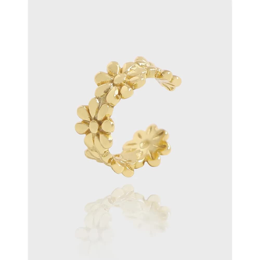 Polished sterling silver floral hoop earrings with petal details forming a curved hoop.