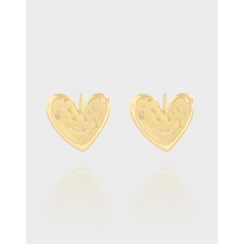 Pair of heart-shaped stud earrings with a polished silver finish and dotted texture.