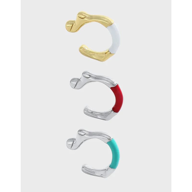 Curved sterling silver hoop earrings with enamel color on the outer arc.