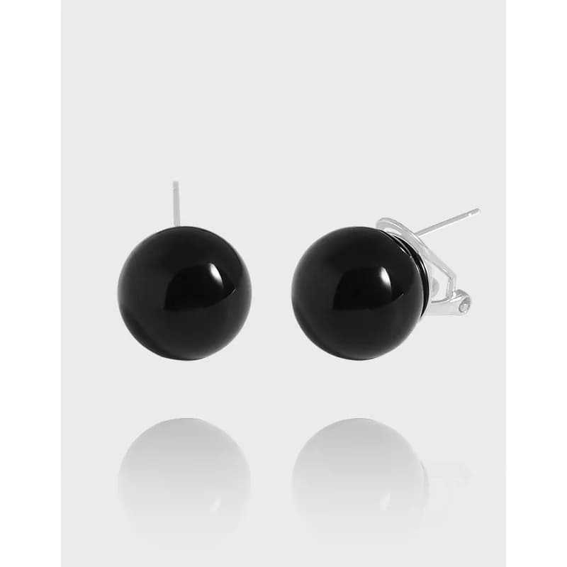Pair of polished sterling silver ball stud earrings with glossy black spheres