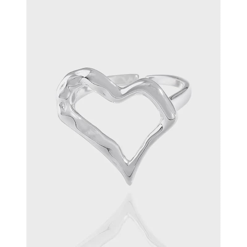 Polished sterling silver open heart ring with a sculpted, negative-space heart design.