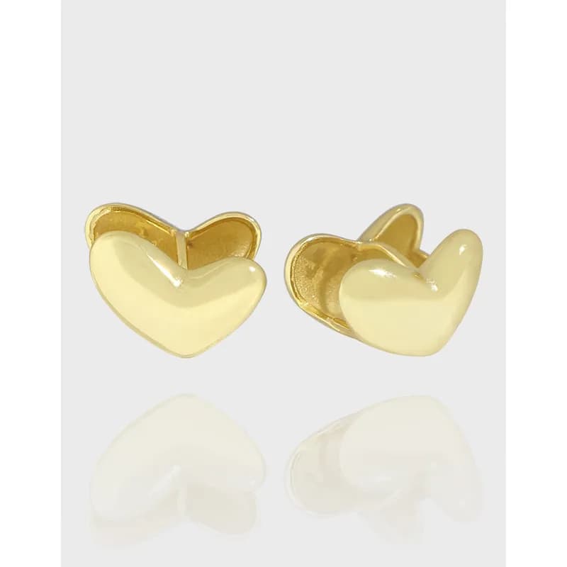 Pair of polished heart-shaped stud earrings in silver with backs shown