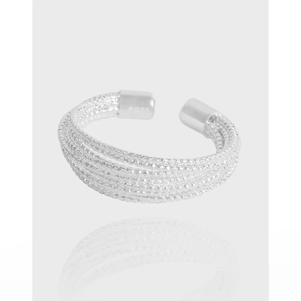Open-ended sterling silver ring with five twisted beaded strands forming a stacked band.