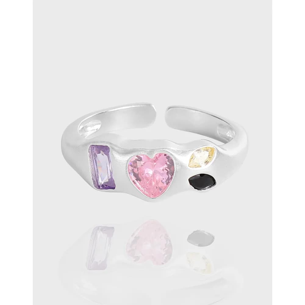 Polished sterling silver open-band ring with a pink heart gem and colorful stones set along the band.