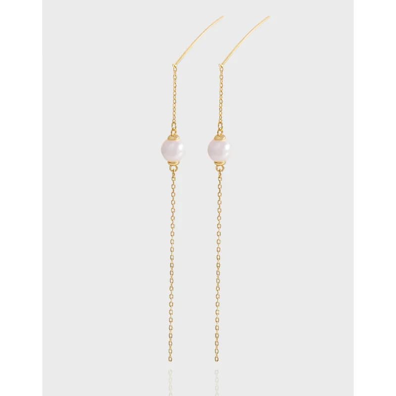 Two slender pearl-chain drop earrings suspended from curved ear wires in polished metal.