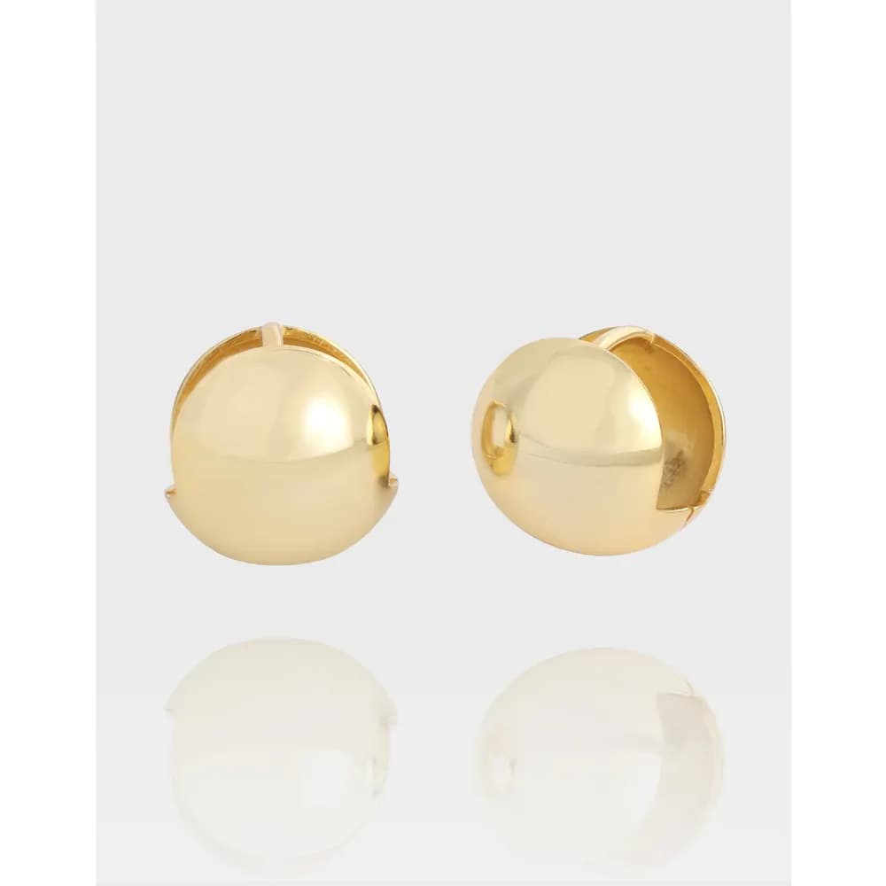 Two polished dome-shaped stud earrings in sterling silver on a light background.