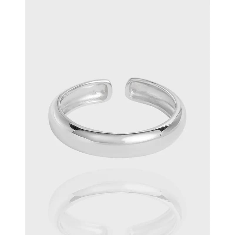 Polished sterling silver open cuff ring with a curved, open-ended band
