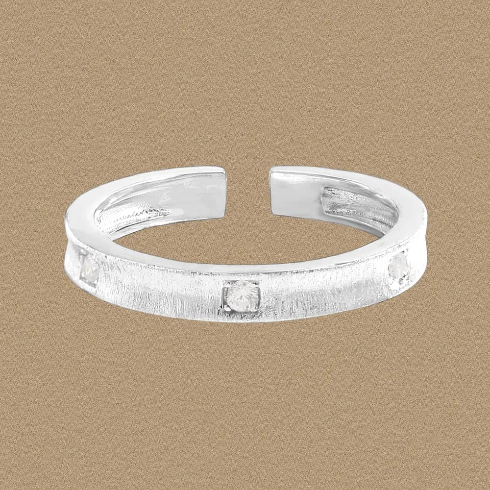 Sterling silver open-ring with square stone settings along a brushed band.