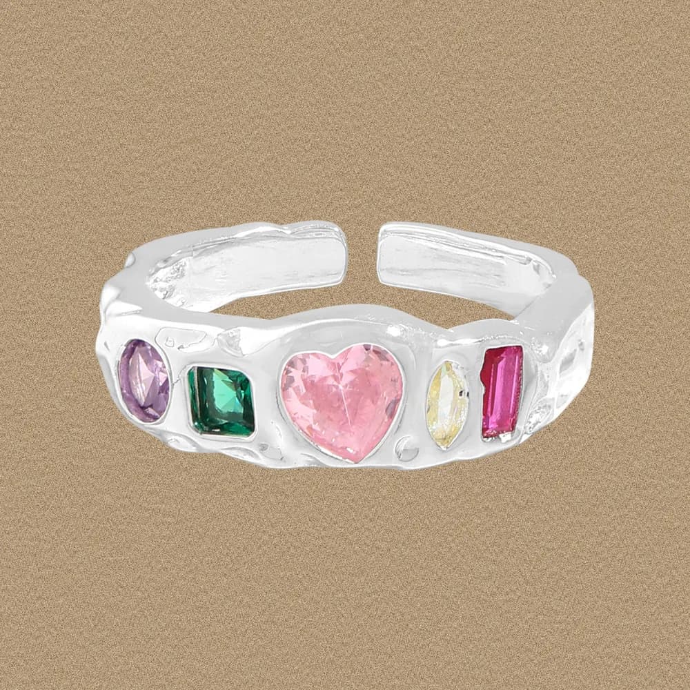 Polished sterling silver ring with multiple colorful stones set along the top of the band.