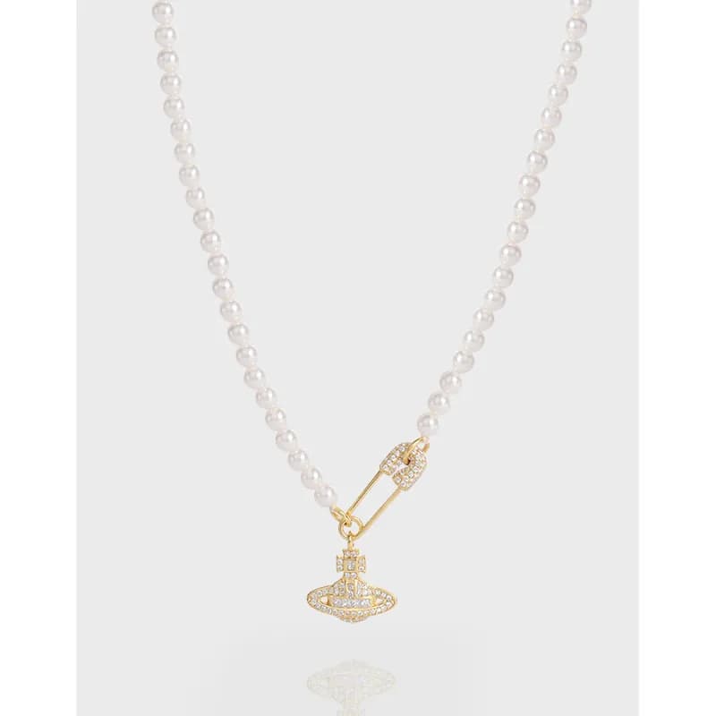Pearl bead necklace with a crystal-encrusted pendant charm hanging from a clasp