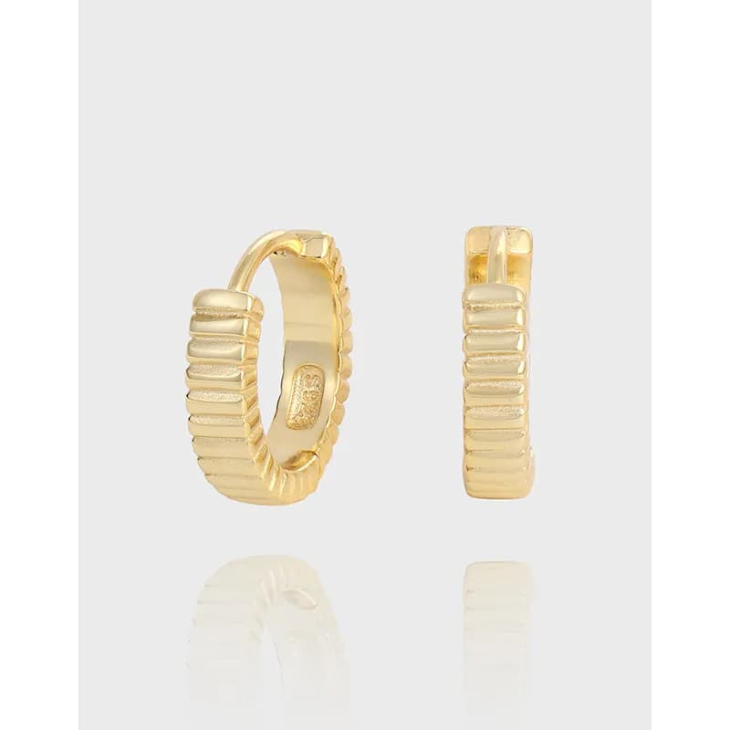 Polished sterling silver ribbed hoop earrings with a hinged closing mechanism.